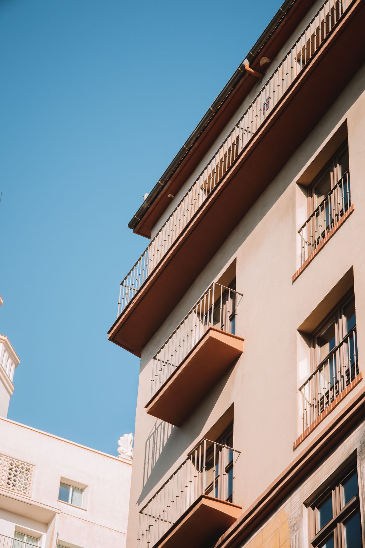 Marlowe Point residence facade with balconies under a clear blue sky