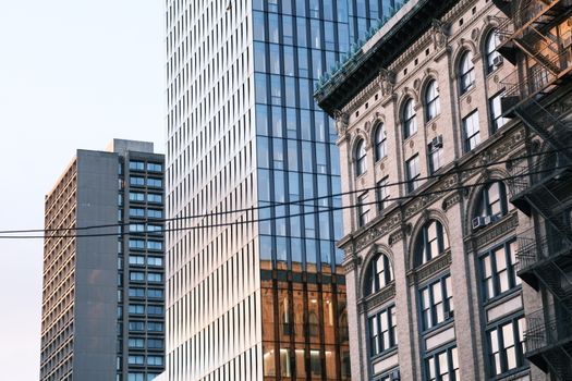 Stunning view of New York City's diverse architecture at dusk, showcasing modern and historic buildings.