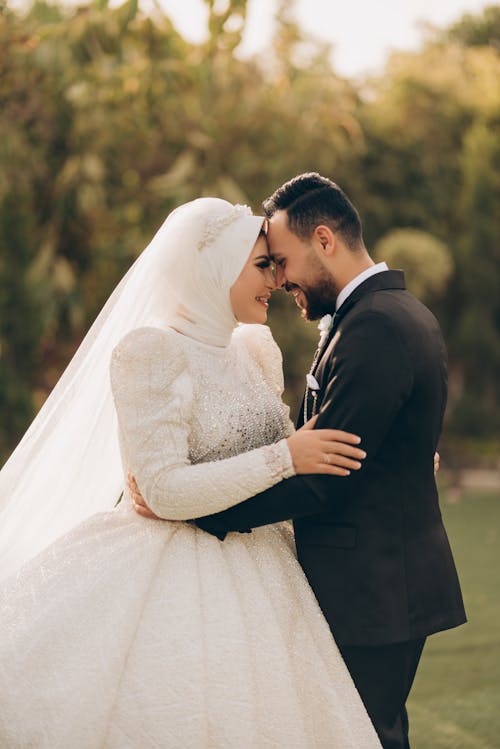 Newlywed Smiling Couple Standing in Park