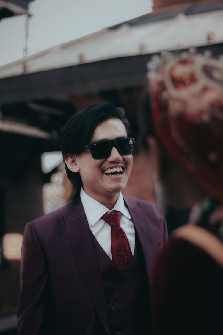 Smiling Man In Sunglasses And Suit