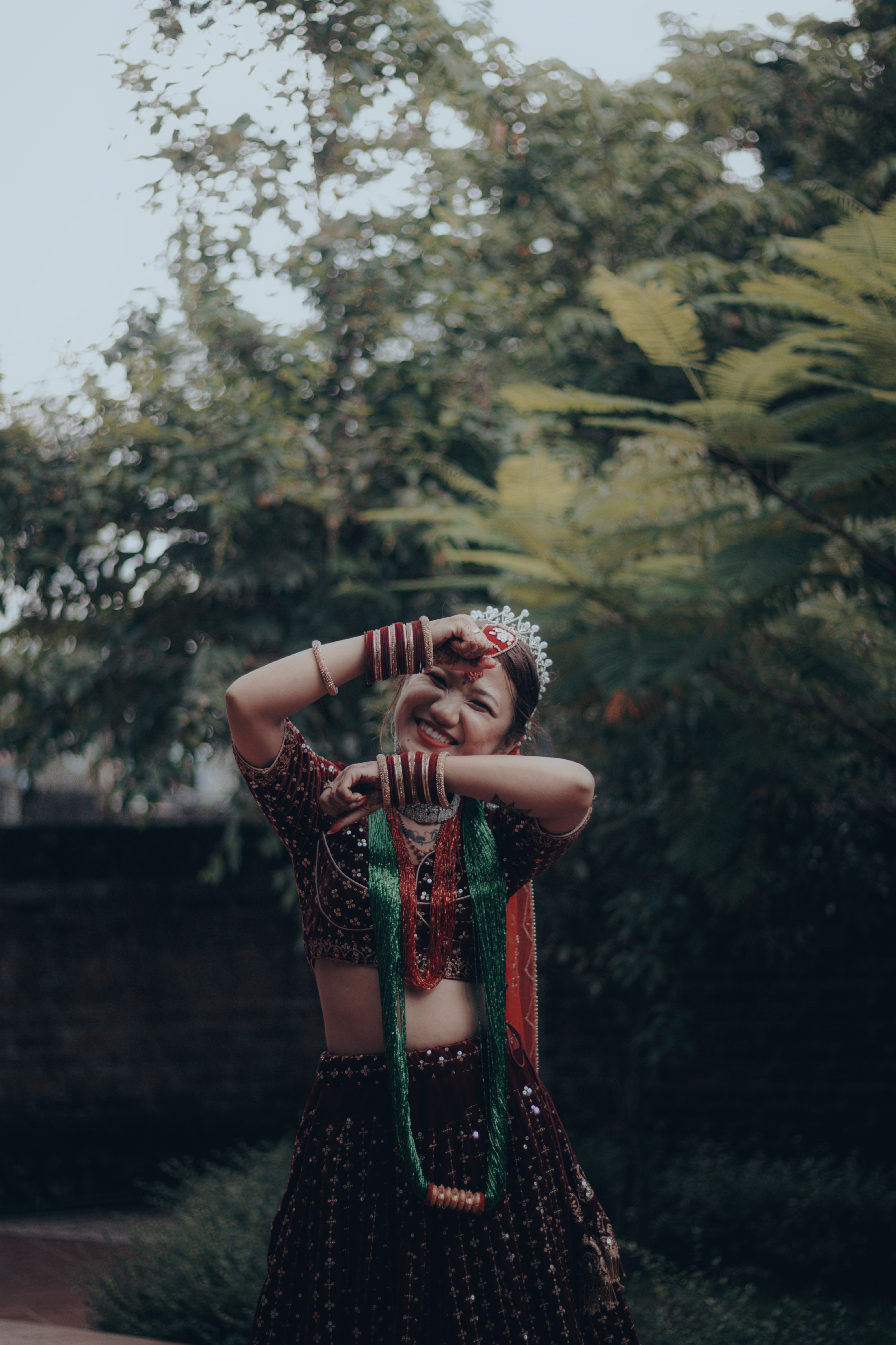 Smiling Woman Posing in Traditional Clothing · Free Stock Photo