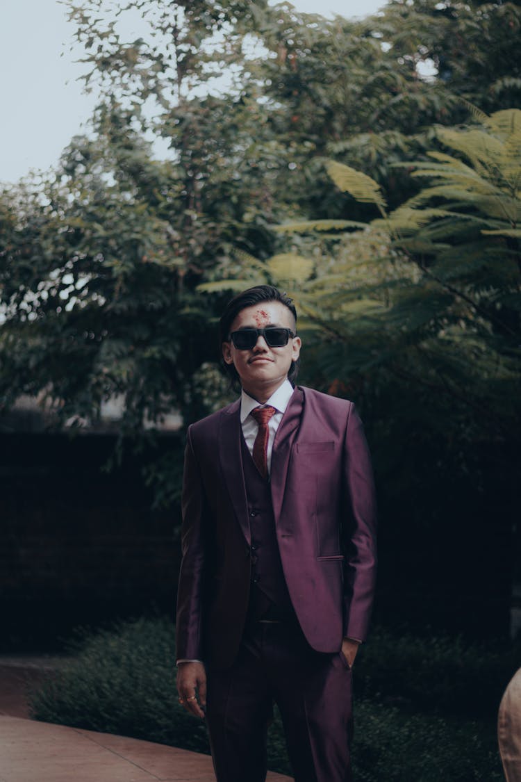 Man Posing In Purple Suit