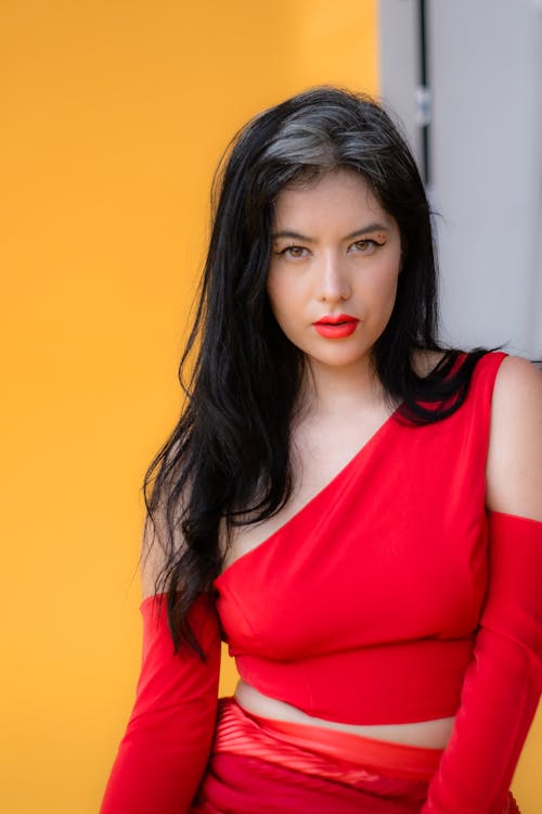 Woman in Red Clothing Posing in Studio