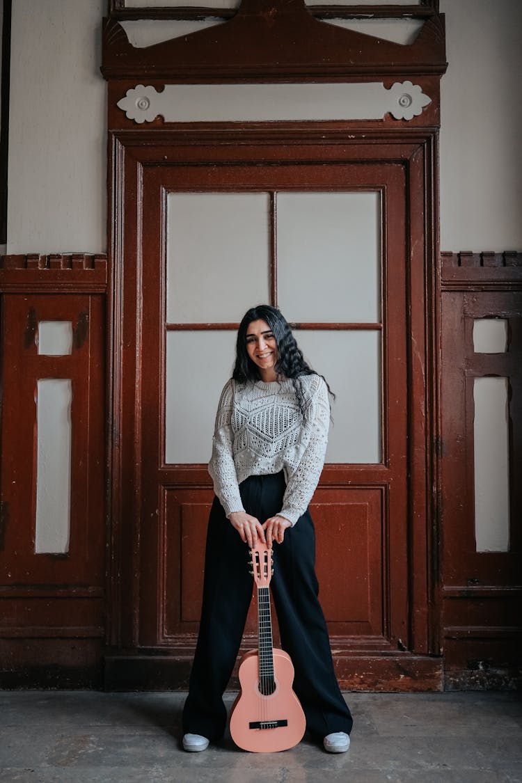 Woman Posing With Guitar