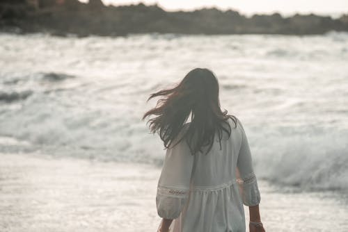 Woman Looking on Stormy Sea