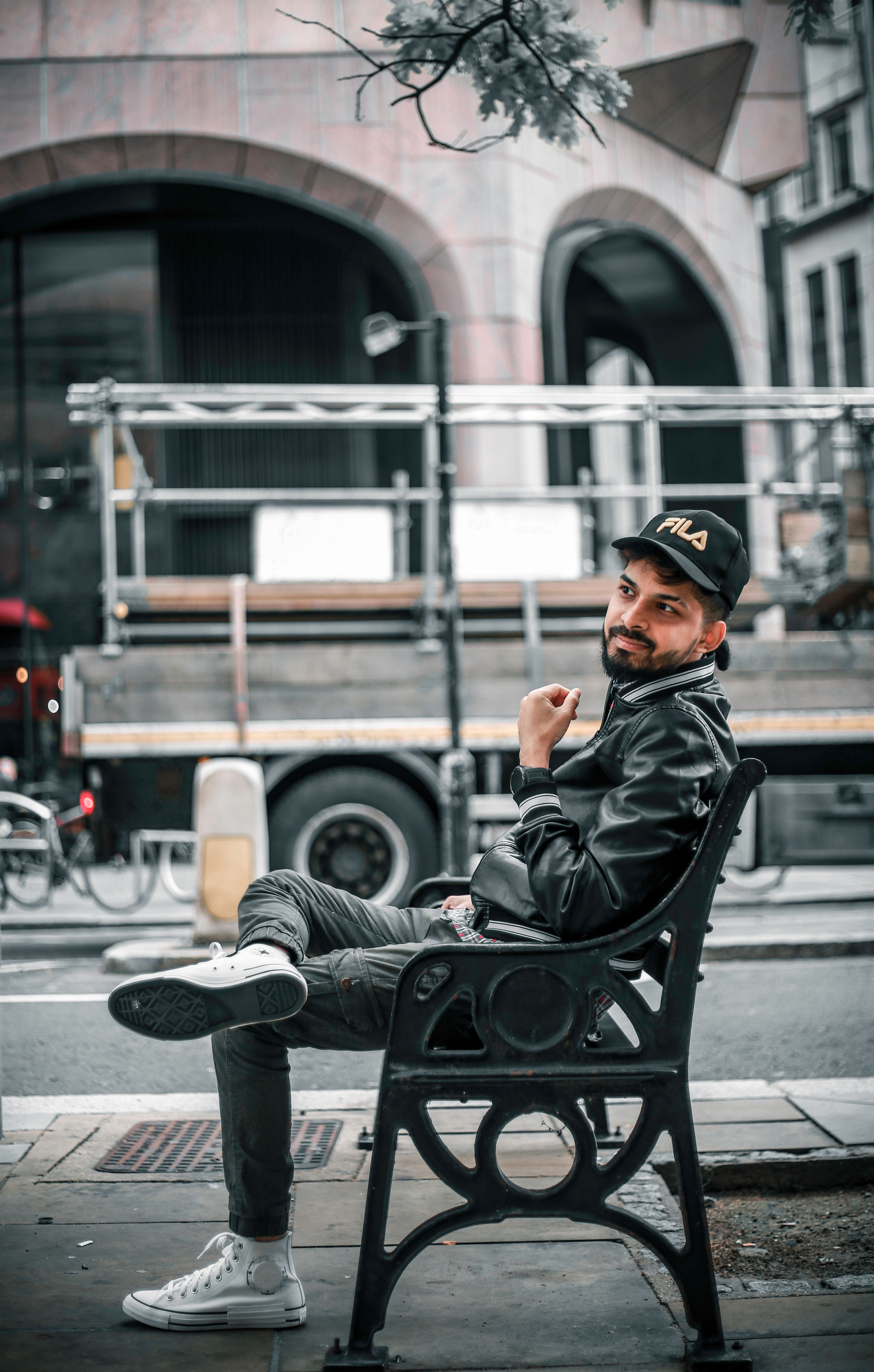 Man Sitting on the Bench in a City · Free Stock Photo