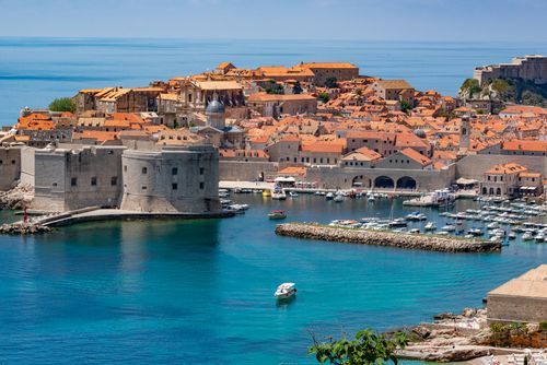 Free Stunning aerial view of Dubrovnik's historic fortress and marina with vibrant blue waters. Stock Photo