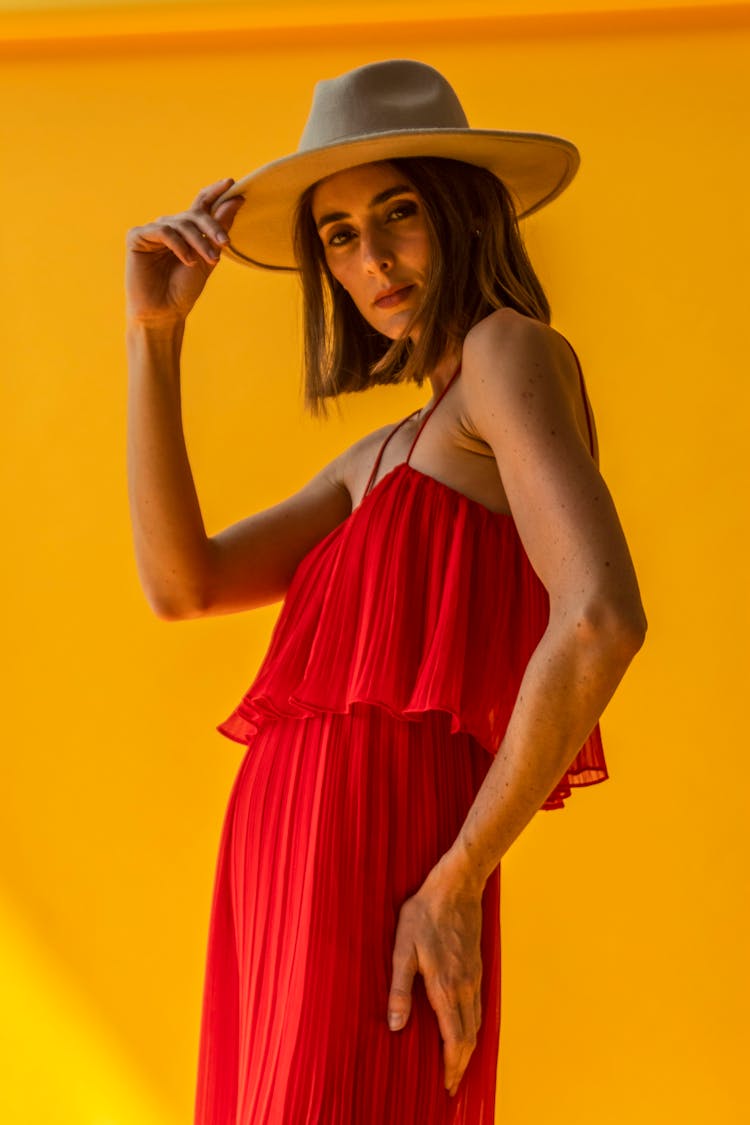 Woman In A Red Dress And Wide Brimmed Hat