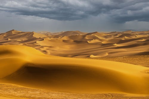Scenic View of Desert under Storm Clouds 