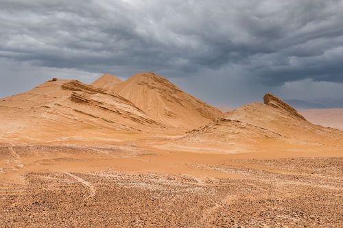 Free Capture of a rugged desert landscape under moody, cloudy skies. Stock Photo