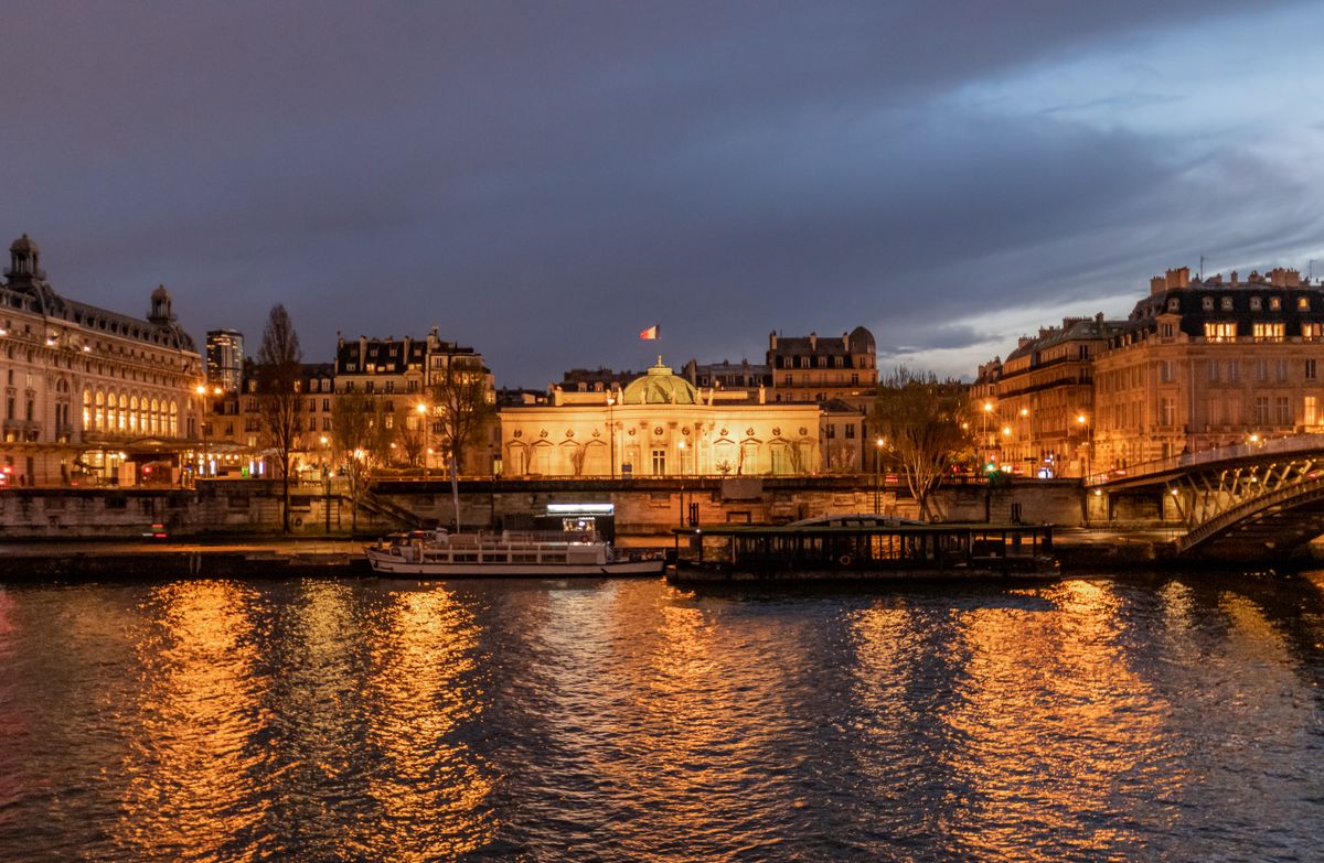 The Seine river at blue hour with bateaux-mouches