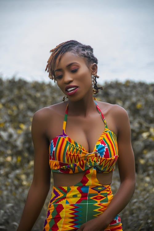 Young Woman in a Colorful Outfit Posing Outdoors 