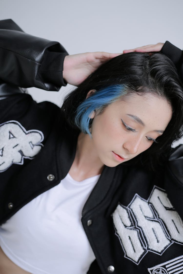 Young Woman In Letterman Jacket