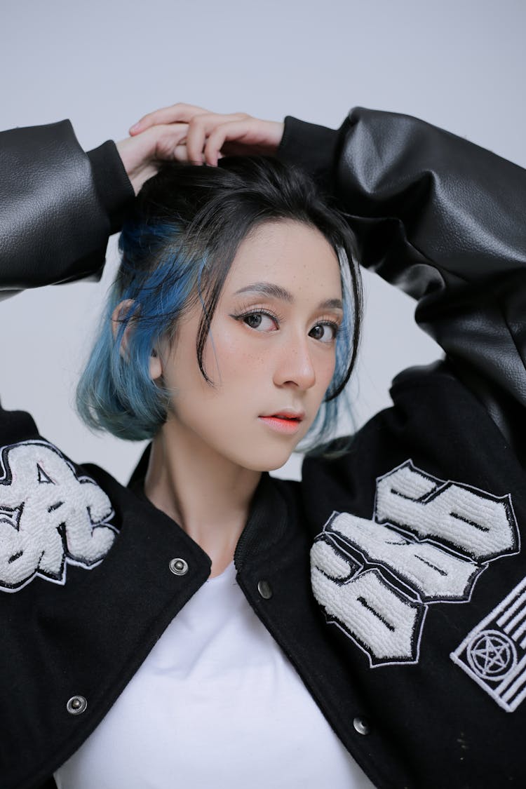 Woman Posing In Letterman Jacket