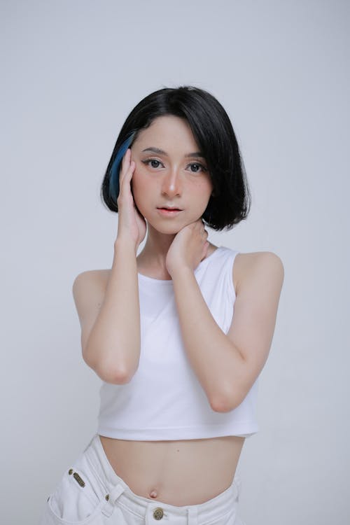 Young Brunette Woman Posing in White Cropped Top