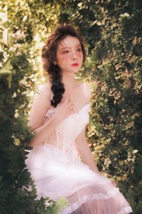 Bridal dress in a forest setting