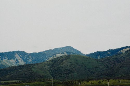 Free Explore the serene green hills and mountains of Talgar, Kazakhstan, showcasing natural beauty. Stock Photo