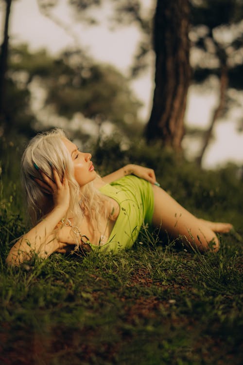 Blonde Woman Lying Down on Grass