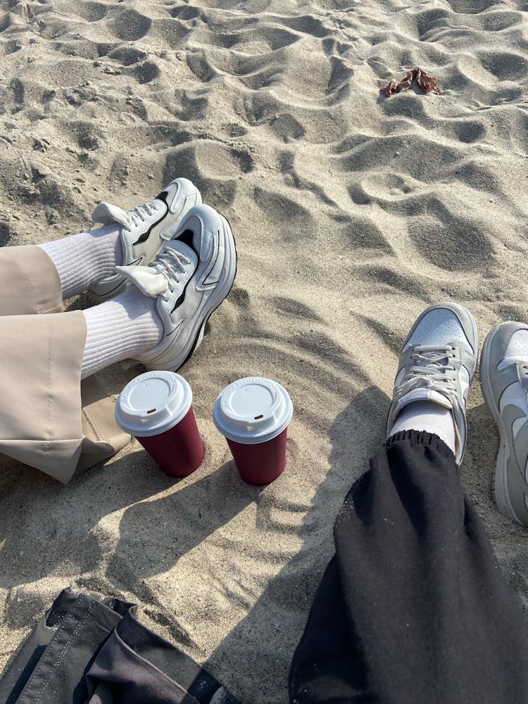 People Legs On A Beach