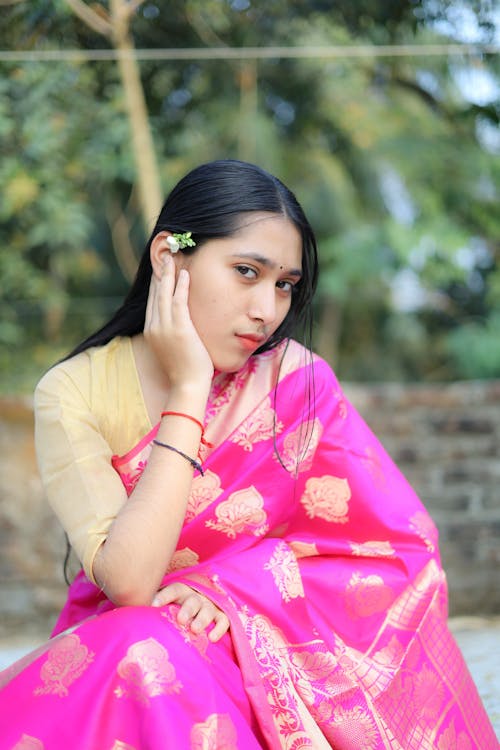 Young Woman Wearing a Traditional Pink Sari Dress