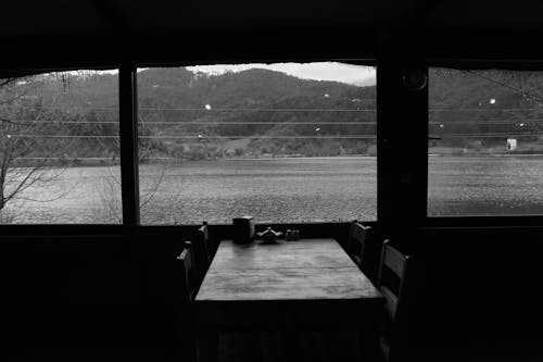 Empty Wooden Table in Restaurant near River