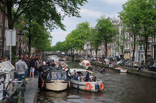 Ingyenes stockfotó Amszterdam, csatorna, csónakok témában