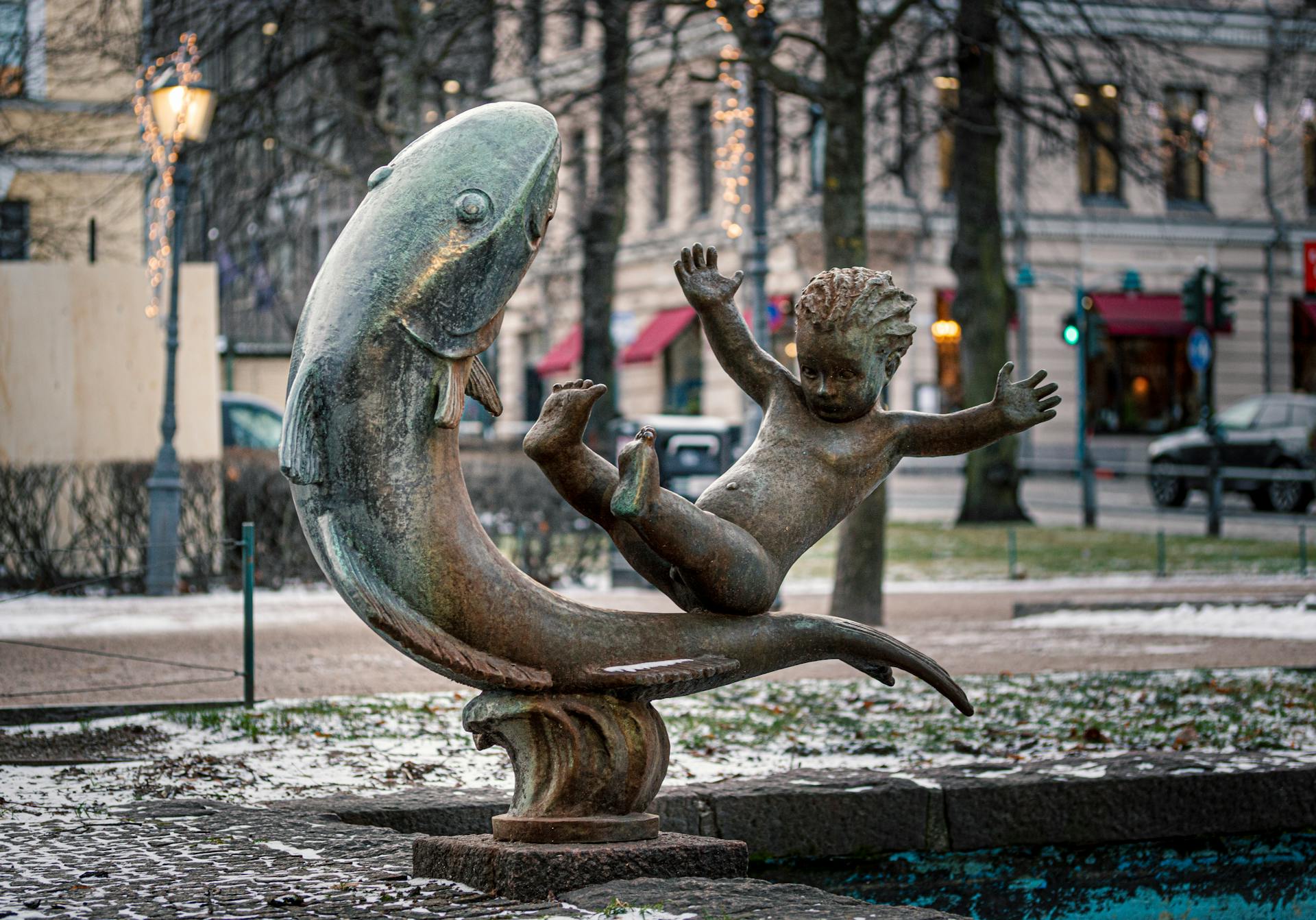 Sculpture of a Boy Riding on a Large Fish, Hei Vaan, Helsinki, Finland
