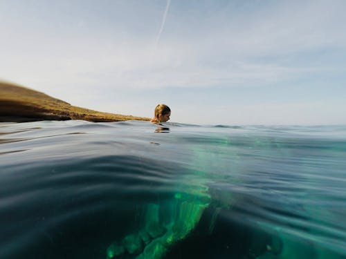Free Photo of Woman Swimming In Ocean Stock Photo