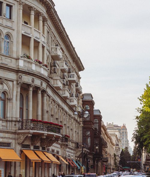 Free Capturing the elegant facades of historic buildings on a vibrant city street, perfect for travel and urban themes. Stock Photo