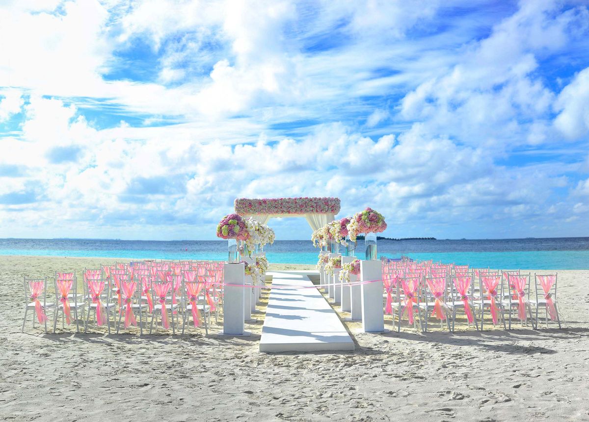 Wedding reception tables with white linens