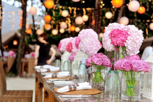 Free Table With Plates and Flowers Filed Neatly Selective Focus Photography Stock Photo