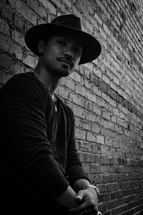 Man in Hat Posing in Black and White