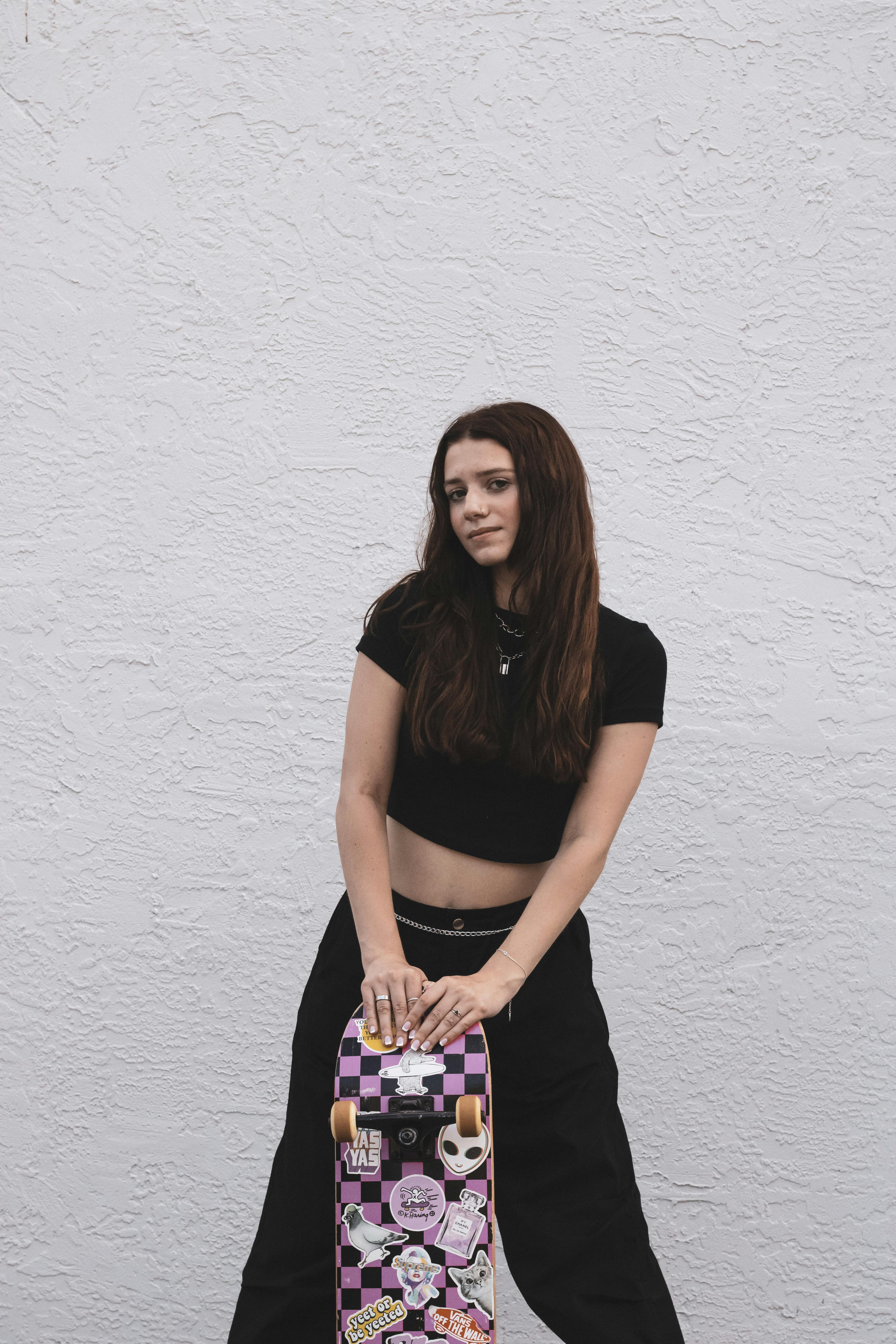 Young beautiful fashion model girl with a handbag in a black T