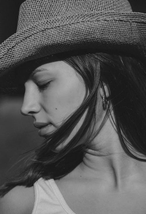 Woman in Hat Posing with Eyes Closed