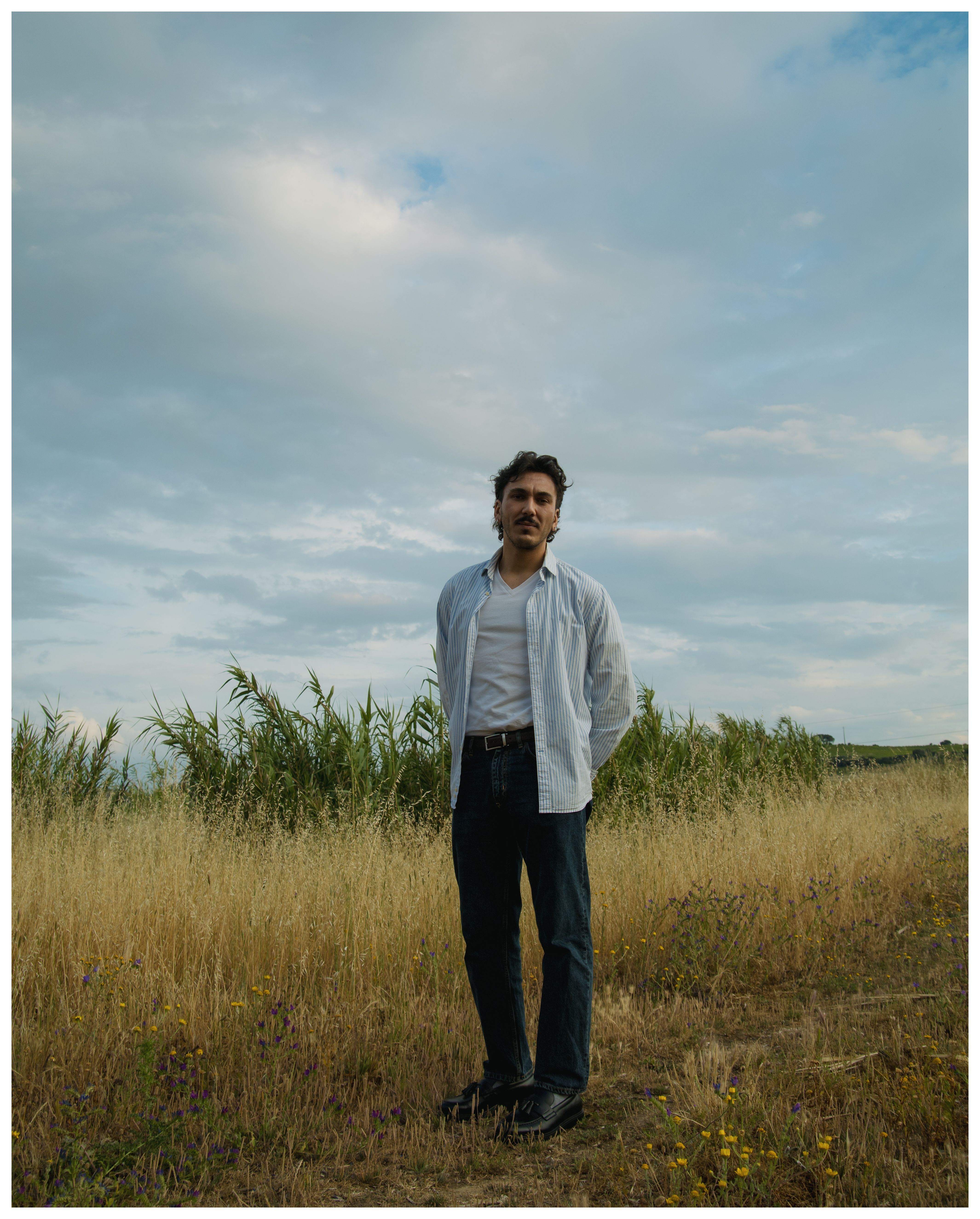 A Man Standing on a Field · Free Stock Photo