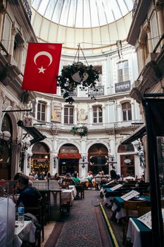 Elegant restaurant with Turkish ambiance inside the historic Çiçek Pasajı in Istanbul.