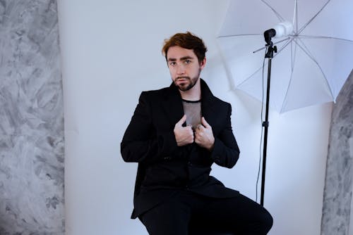 Man in Black Suit at Photo Session