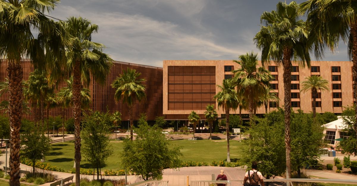 HTU campus building with students walking on sunny day