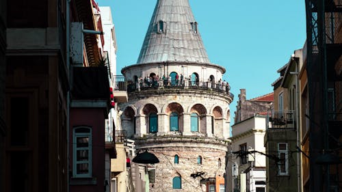 Free Close-up of the Galata Tower seen between Buildings in Istanbul, Turkey  Stock Photo