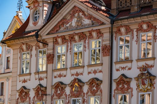 Elegant Baroque building facade in Prague, showcasing intricate design elements.