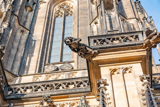 Close-up of Gothic facade details and sculptures at St. Vitus Cathedral in Prague.
