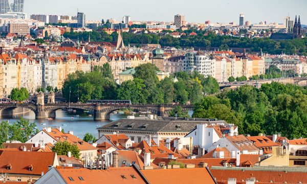 Explore the historic charm of Prague's bridges and architecture with this stunning aerial cityscape.