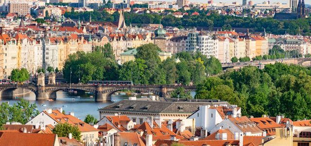 Explore the historic charm of Prague's bridges and architecture with this stunning aerial cityscape.