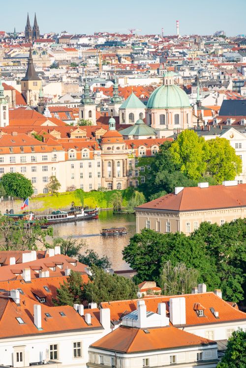 Free Stunning aerial view of Prague's historic architecture with Vltava River backdrop. Stock Photo