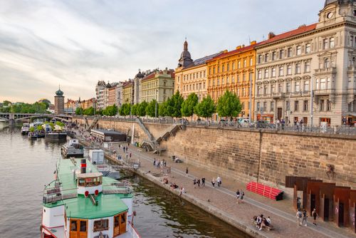 Free Explore the scenic Vltava River with traditional architecture and lively promenade in Prague. Stock Photo