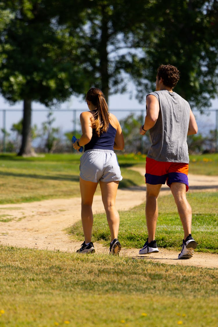 Couple Running In Park