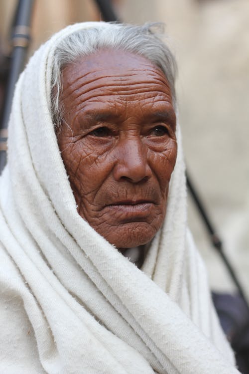 Candid Portrait of an Elderly Woman Wearing a Veil 