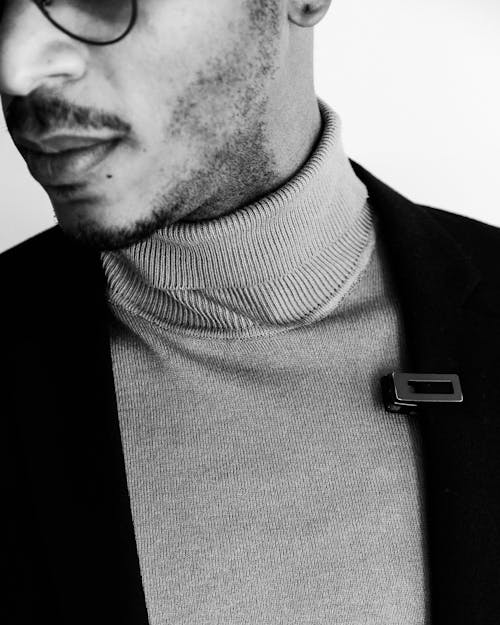 Close-up of a Man Wearing a Turtleneck and a Blazer 