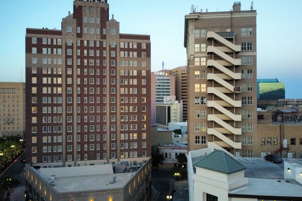 Aerial view of modern buildings in downtown El Paso at dusk.