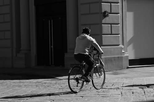 Man on Bicycle in Black and White